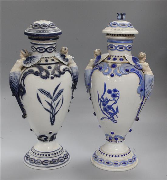 A pair of Sitzendorf blue enamel vases